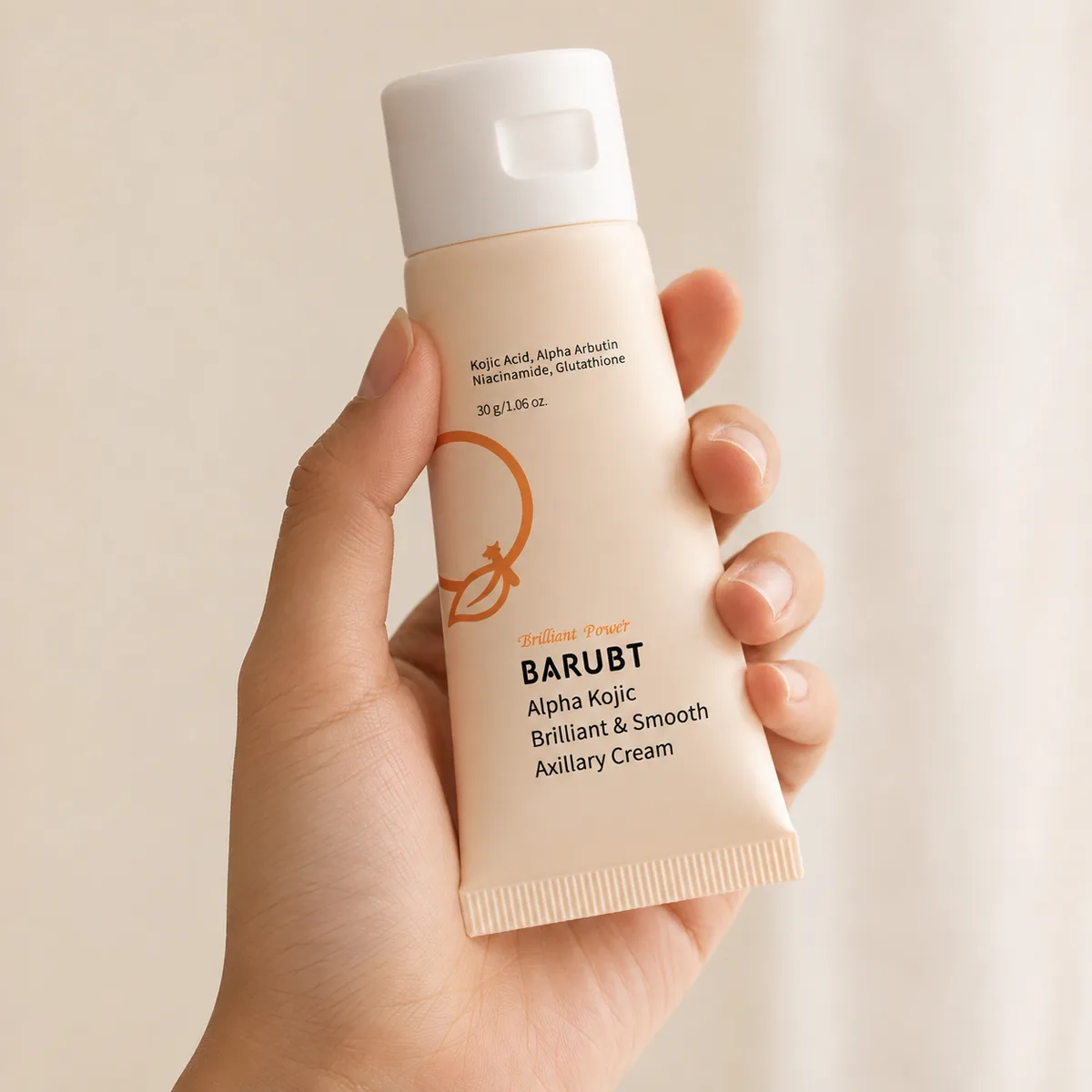 A hand holding the 30 g undim brightening cream tube, shown at real scale